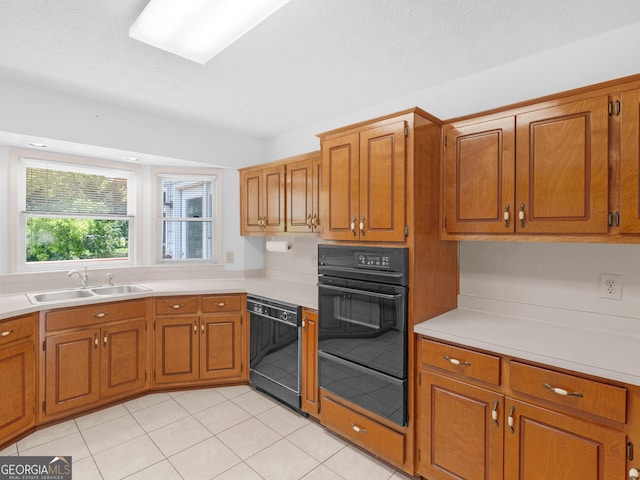 114 Overlook Dr, Mcdonough, GA 30252 - kitchen with a sink, black appliances, a warming drawer, and brown cabinetry