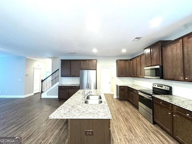 364 Dublin Way, Dallas, GA 30132 - kitchen featuring appliances with stainless steel finishes, a sink, dark brown cabinetry, dark wood finished floors, and recessed lighting