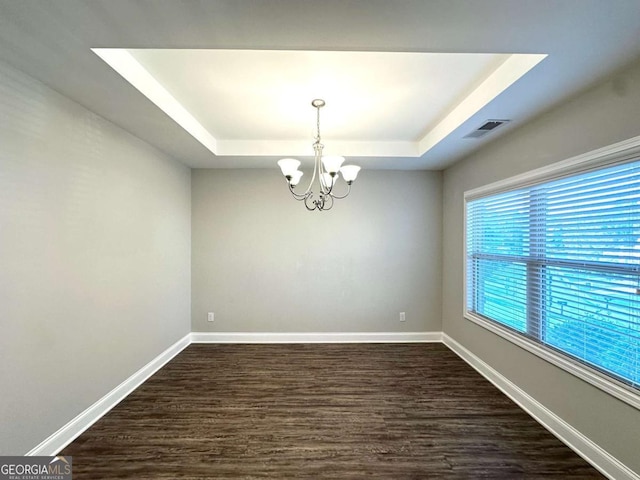 364 Dublin Way, Dallas, GA 30132 - unfurnished room featuring a raised ceiling, a chandelier, dark wood-type flooring, and baseboards
