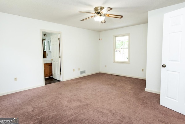 215 Cooper Rd, Athens, GA 30605 - unfurnished bedroom with dark carpet, baseboards, and connected bathroom