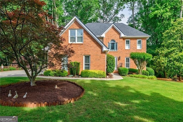 3620 Chartwell Dr, Suwanee, GA 30024 - colonial inspired home featuring a front lawn and brick siding
