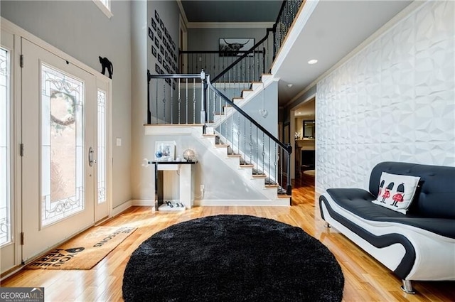 3620 Chartwell Dr, Suwanee, GA 30024 - entrance foyer with wood finished floors, healthy amount of natural light, stairs, crown molding, and a high ceiling