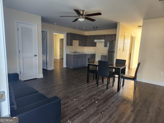 108 Ronald Pride, Fort Valley, GA 31030 - dining space featuring ceiling fan, baseboards, and dark wood-type flooring