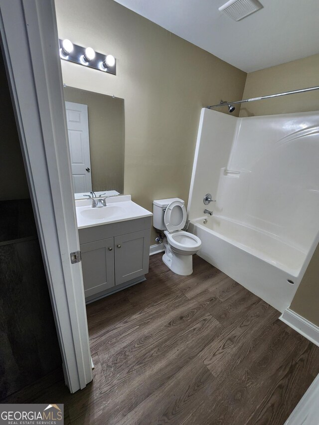 108 Ronald Pride, Fort Valley, GA 31030 - bathroom with toilet, wood finished floors, vanity, and shower / bath combination