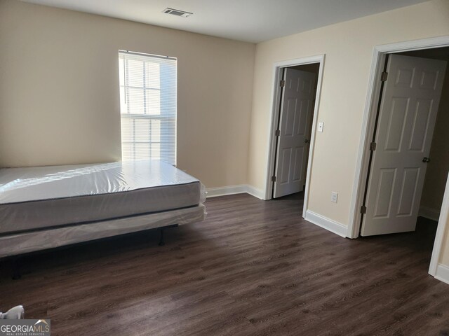 108 Ronald Pride, Fort Valley, GA 31030 - bedroom with dark wood-style flooring and baseboards