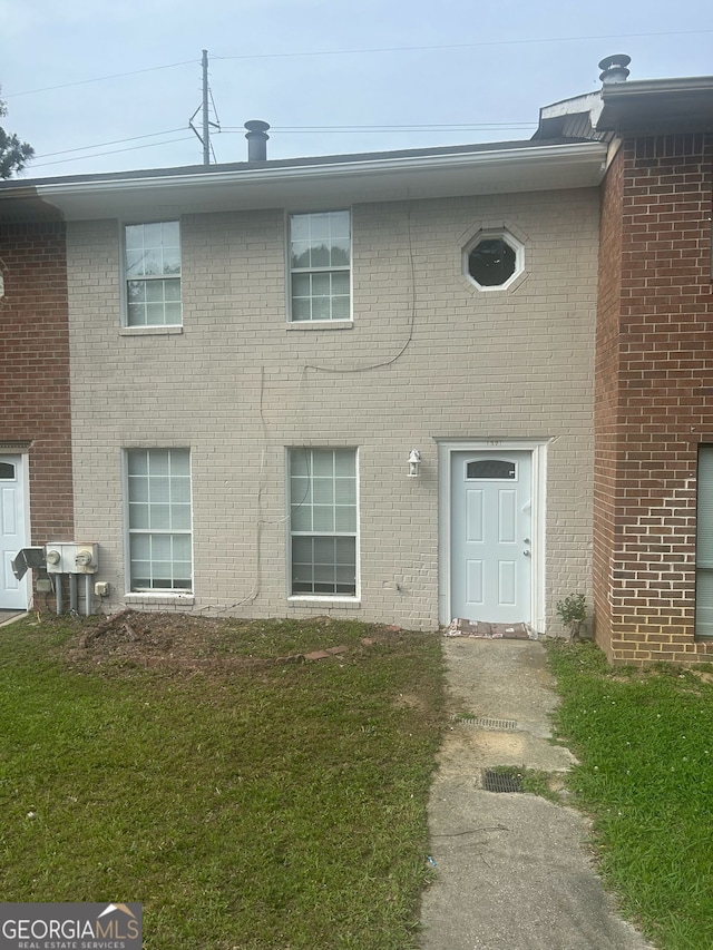 1321 Lakeview Dr NW, Conyers, GA 30012 - townhome / multi-family property featuring a front lawn and brick siding