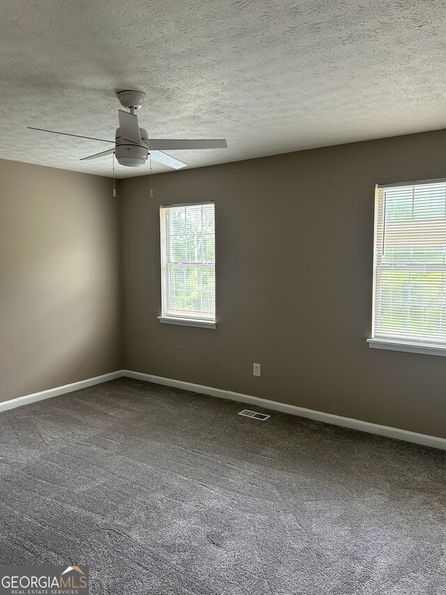 1321 Lakeview Dr NW, Conyers, GA 30012 - empty room with a ceiling fan, baseboards, carpet flooring, and a textured ceiling