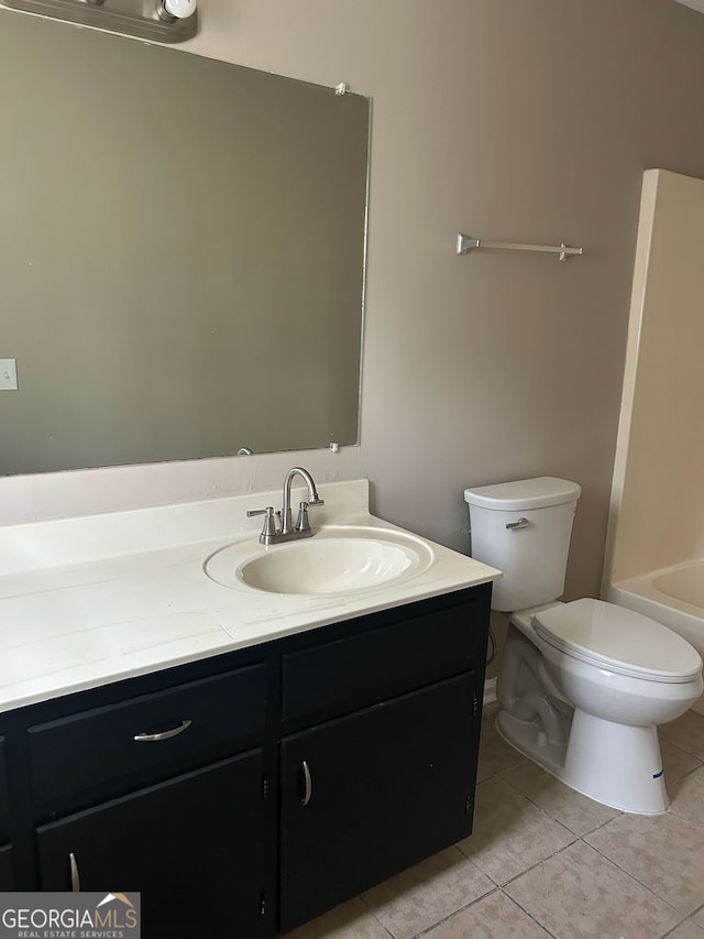 1321 Lakeview Dr NW, Conyers, GA 30012 - bathroom featuring vanity, tile patterned floors, and toilet