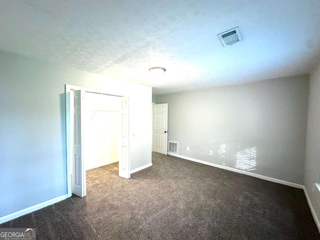 3170 W Point Cir, Douglasville, GA 30135 - unfurnished bedroom with dark carpet, baseboards, and a closet