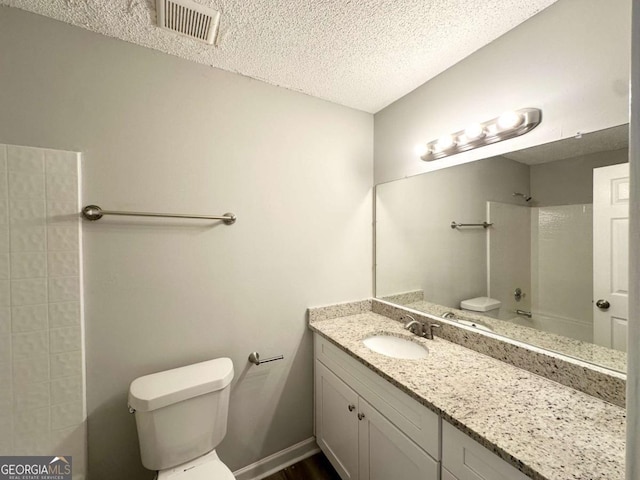 3170 W Point Cir, Douglasville, GA 30135 - full bath featuring toilet, a textured ceiling, vanity, and bathing tub / shower combination