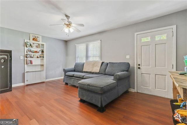 118 Greenwood St, Fairburn, GA 30213 - living area with a ceiling fan, wood finished floors, and baseboards