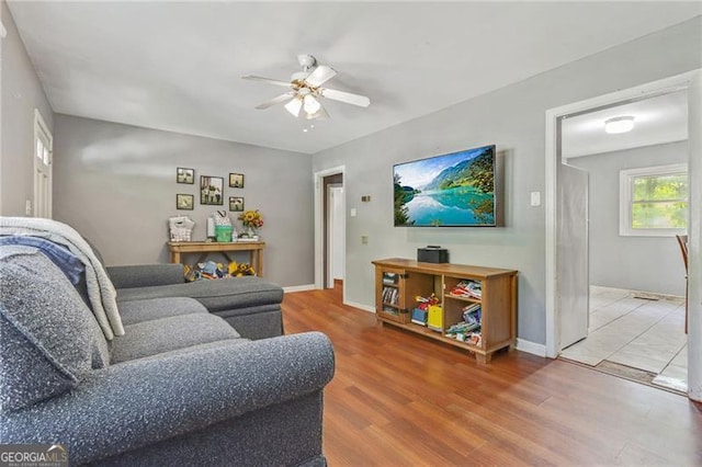 118 Greenwood St, Fairburn, GA 30213 - living area with ceiling fan, wood finished floors, and baseboards