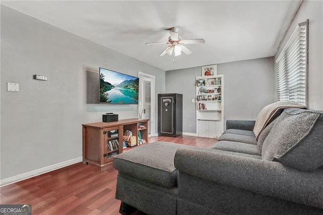 118 Greenwood St, Fairburn, GA 30213 - living area featuring ceiling fan, wood finished floors, and baseboards