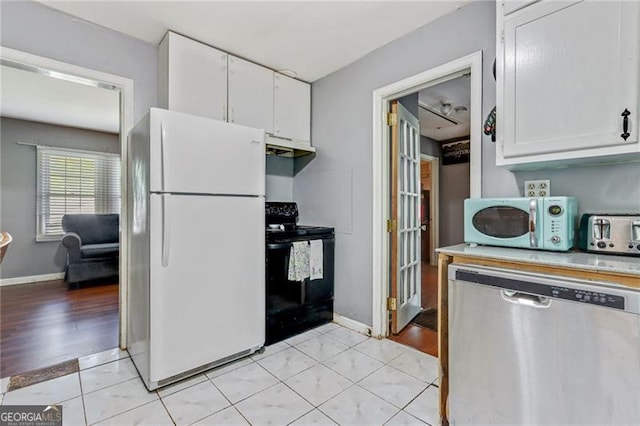 118 Greenwood St, Fairburn, GA 30213 - kitchen featuring white appliances, light countertops, white cabinets, and under cabinet range hood