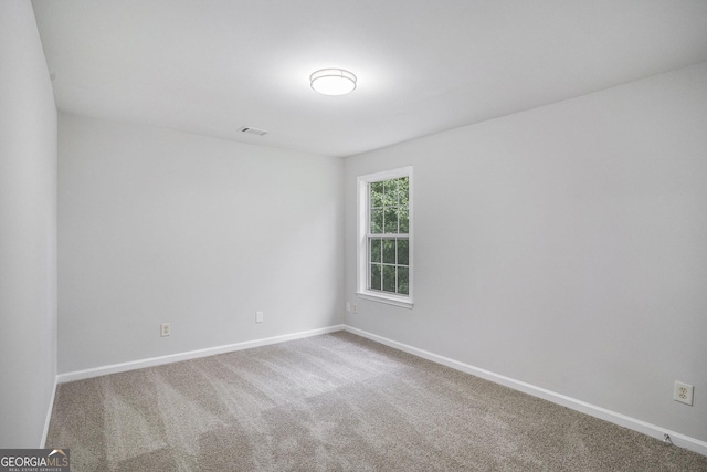 2681 Lakeside Dr SW, Conyers, GA 30094 - empty room with carpet flooring and baseboards