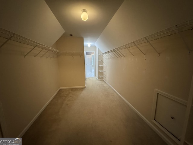 1031 Jordan Rd, Dacula, GA 30019 - walk in closet featuring vaulted ceiling and carpet flooring