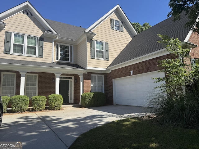 1031 Jordan Rd, Dacula, GA 30019 - view of front of property with brick siding, concrete driveway, and an attached garage