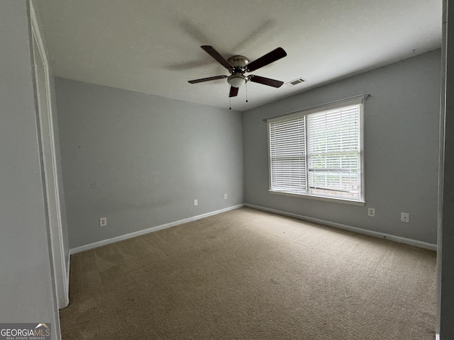1031 Jordan Rd, Dacula, GA 30019 - carpeted empty room featuring baseboards and a ceiling fan
