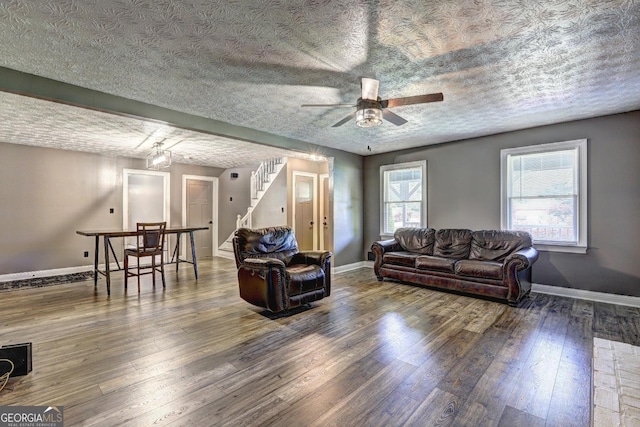 108 Country Acres Ct, Mcdonough, GA 30253 - living area featuring hardwood / wood-style floors, ceiling fan, a textured ceiling, baseboards, and stairway