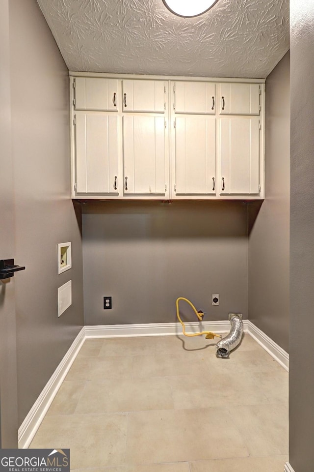 108 Country Acres Ct, Mcdonough, GA 30253 - laundry room with cabinet space, hookup for a washing machine, baseboards, and a textured ceiling