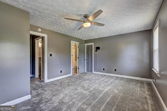108 Country Acres Ct, Mcdonough, GA 30253 - unfurnished bedroom with carpet floors, a textured ceiling, and baseboards