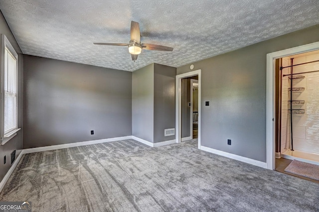108 Country Acres Ct, Mcdonough, GA 30253 - carpeted spare room featuring ceiling fan, baseboards, and a textured ceiling