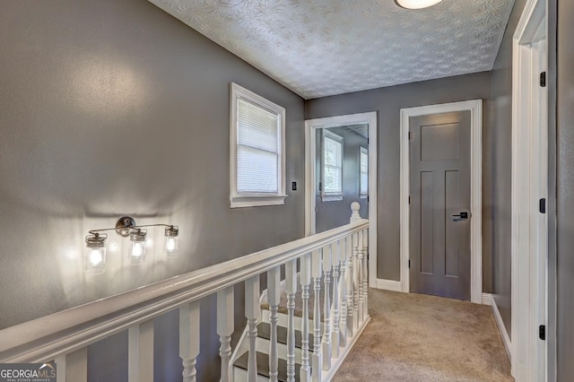 108 Country Acres Ct, Mcdonough, GA 30253 - hall with light colored carpet, baseboards, and a textured ceiling