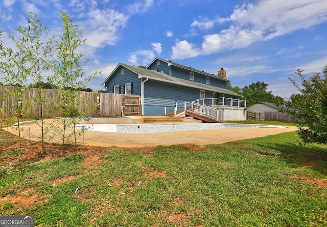 108 Country Acres Ct, Mcdonough, GA 30253 - back of property with a chimney and a wooden deck