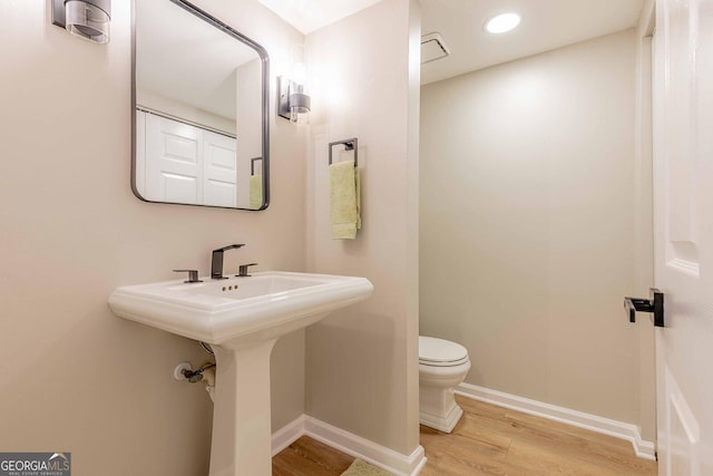 2012 Variations Dr NE, Atlanta, GA 30329 - half bath with wood finished floors, toilet, and baseboards