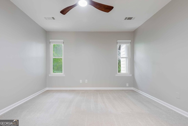2012 Variations Dr NE, Atlanta, GA 30329 - unfurnished room with plenty of natural light, a ceiling fan, light colored carpet, and baseboards