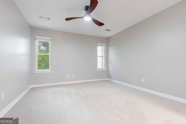 2012 Variations Dr NE, Atlanta, GA 30329 - unfurnished room featuring plenty of natural light, light colored carpet, a ceiling fan, and baseboards