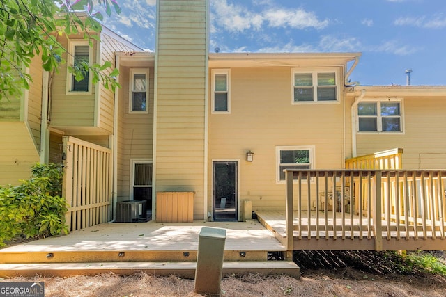 2012 Variations Dr NE, Atlanta, GA 30329 - rear view of property featuring a chimney, a deck, and central AC unit