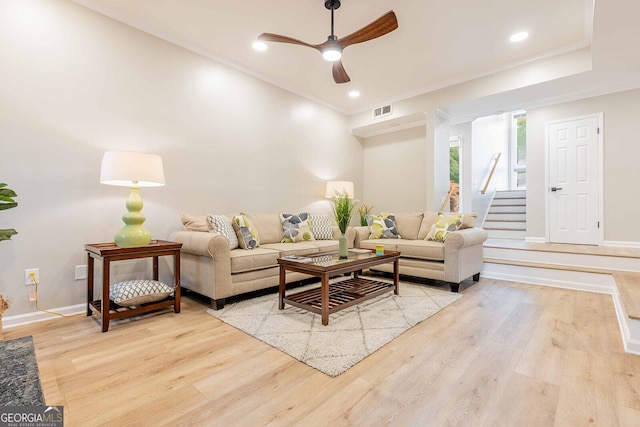 2012 Variations Dr NE, Atlanta, GA 30329 - living room featuring a ceiling fan, wood finished floors, baseboards, stairs, and crown molding