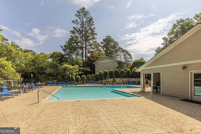 2012 Variations Dr NE, Atlanta, GA 30329 - community pool with a patio and view of scattered trees