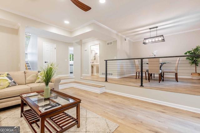 2012 Variations Dr NE, Atlanta, GA 30329 - living area featuring ornamental molding, wood finished floors, recessed lighting, baseboards, and stairway