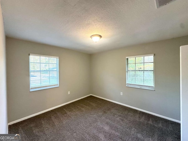4039 Codel St NW, Atlanta, GA 30331 - unfurnished room with dark colored carpet, a textured ceiling, and baseboards