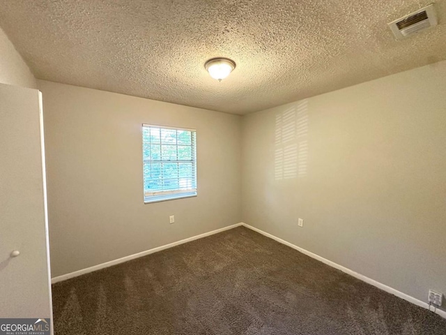 4039 Codel St NW, Atlanta, GA 30331 - empty room with dark colored carpet, a textured ceiling, and baseboards