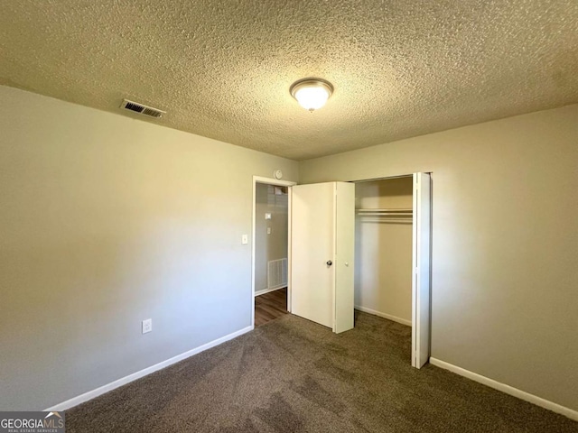 4039 Codel St NW, Atlanta, GA 30331 - unfurnished bedroom featuring carpet flooring, a closet, baseboards, and a textured ceiling