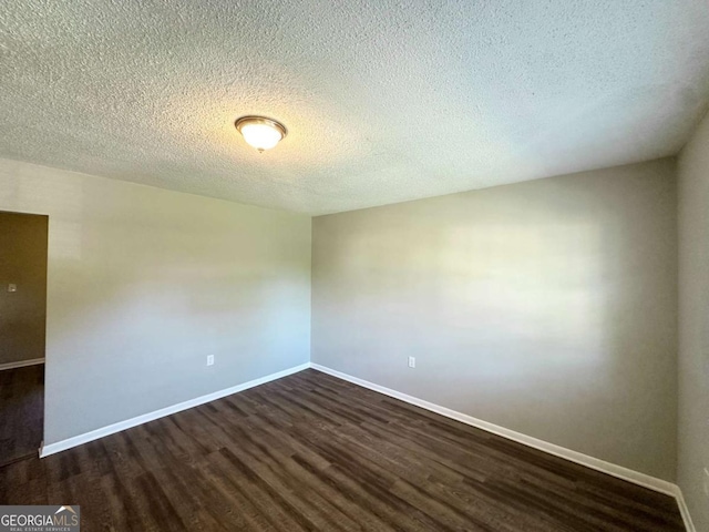4039 Codel St NW, Atlanta, GA 30331 - unfurnished room featuring dark wood finished floors, baseboards, and a textured ceiling