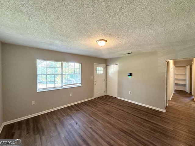 4039 Codel St NW, Atlanta, GA 30331 - foyer with dark wood-type flooring, baseboards, and a textured ceiling