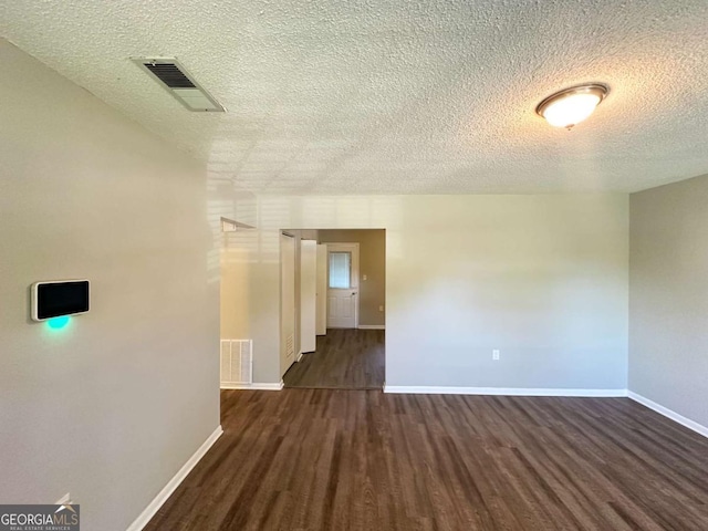 4039 Codel St NW, Atlanta, GA 30331 - unfurnished room featuring dark wood finished floors, baseboards, and a textured ceiling