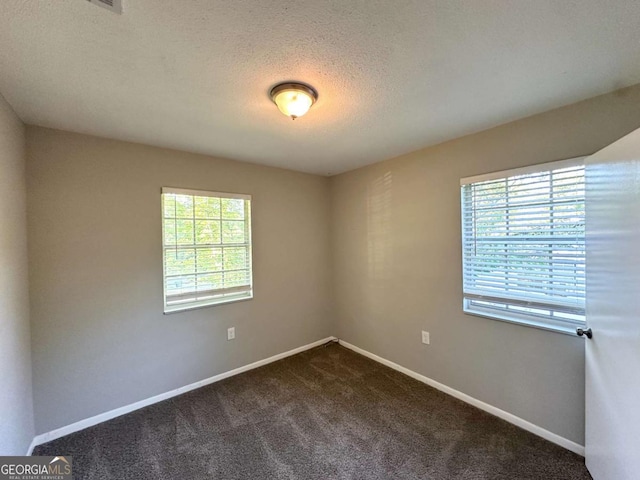 4039 Codel St NW, Atlanta, GA 30331 - unfurnished room featuring dark carpet, baseboards, and a textured ceiling