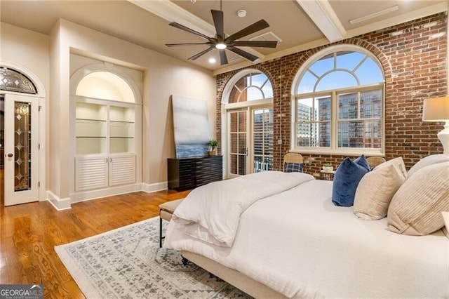 3180 Mathieson Dr NE Unit 1401, Atlanta, GA 30305 - bedroom with brick wall, wood finished floors, baseboards, and ceiling fan