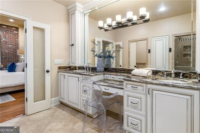 3180 Mathieson Dr NE Unit 1401, Atlanta, GA 30305 - ensuite bathroom featuring double vanity and tile patterned flooring