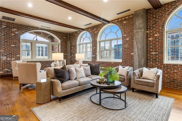 3180 Mathieson Dr NE Unit 1401, Atlanta, GA 30305 - living area with brick wall, wood finished floors, and beamed ceiling
