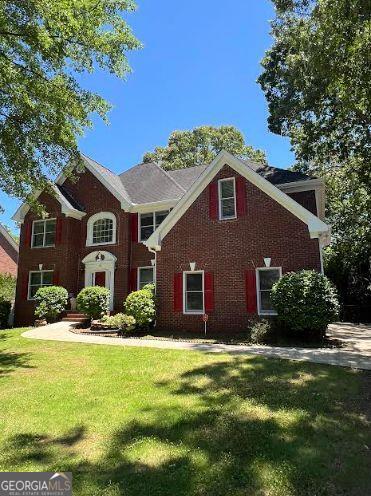 5190 Beech Forest Dr, Lilburn, GA 30047 - view of front of home featuring a front yard