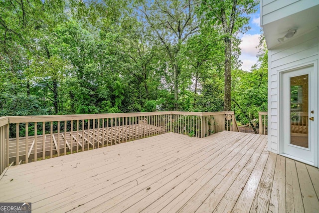 5190 Beech Forest Dr, Lilburn, GA 30047 - wooden terrace featuring view of scattered trees