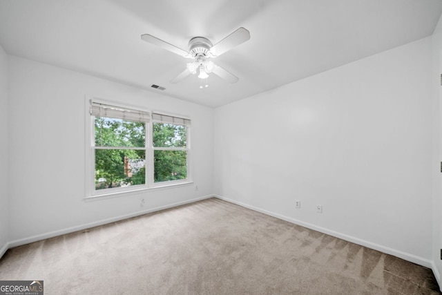 5190 Beech Forest Dr, Lilburn, GA 30047 - carpeted spare room with baseboards and a ceiling fan