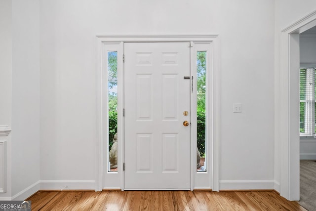 5190 Beech Forest Dr, Lilburn, GA 30047 - entrance foyer featuring baseboards, healthy amount of natural light, and wood finished floors