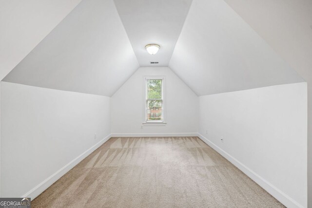 5190 Beech Forest Dr, Lilburn, GA 30047 - bonus room with baseboards, vaulted ceiling, and carpet floors